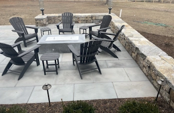 Custom rectangular gas fire pit and stone patio built by S. Phaneuf & Associates in Concord, Massachusetts.