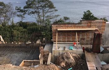 Masonry foundation and retaining wall construction for an infinity pool in Gloucester, Massachusetts