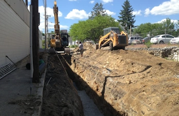 Underground utility lines safely managed beside natural stone installations